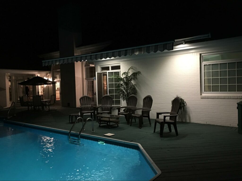 Poolside retractable sun awning with LED lights Miami, Florida motorized lanai  roof | Sun Protection