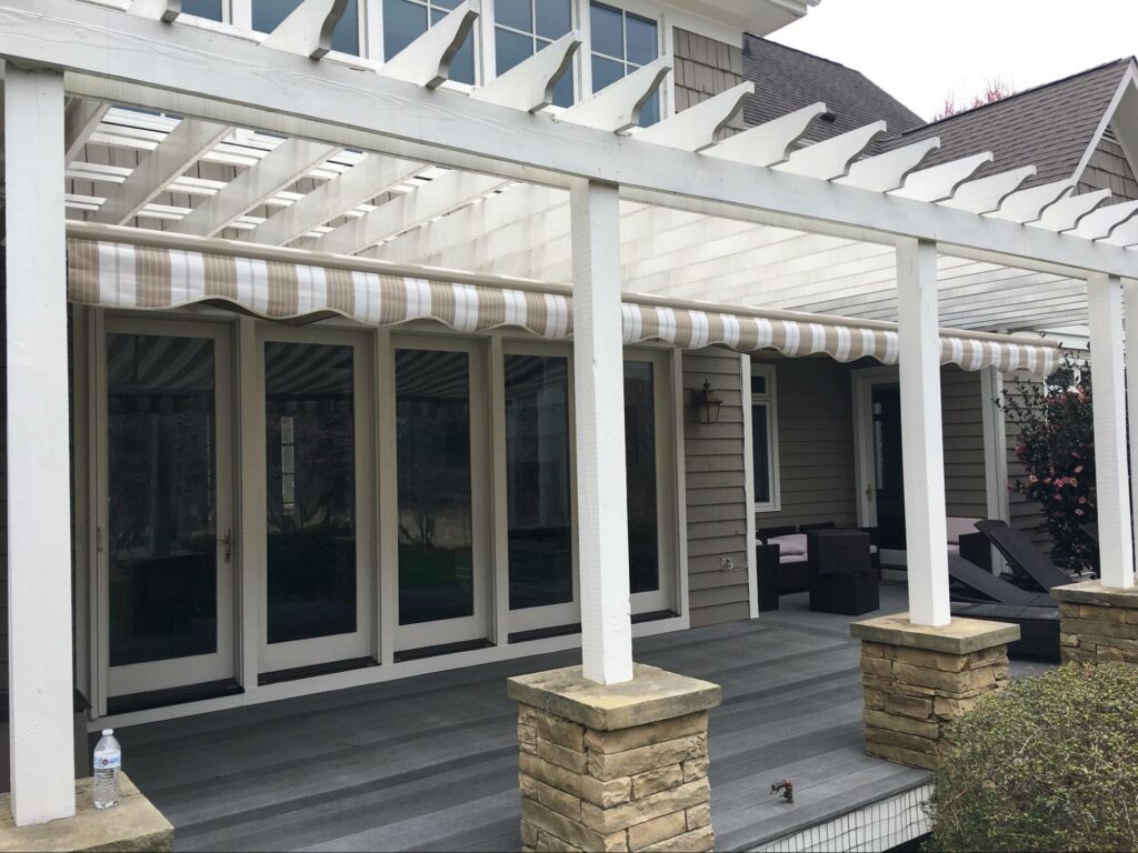 Rolling motorized awning under a pergola  Miami, Florida motorized lanai awnings | Sun Protection