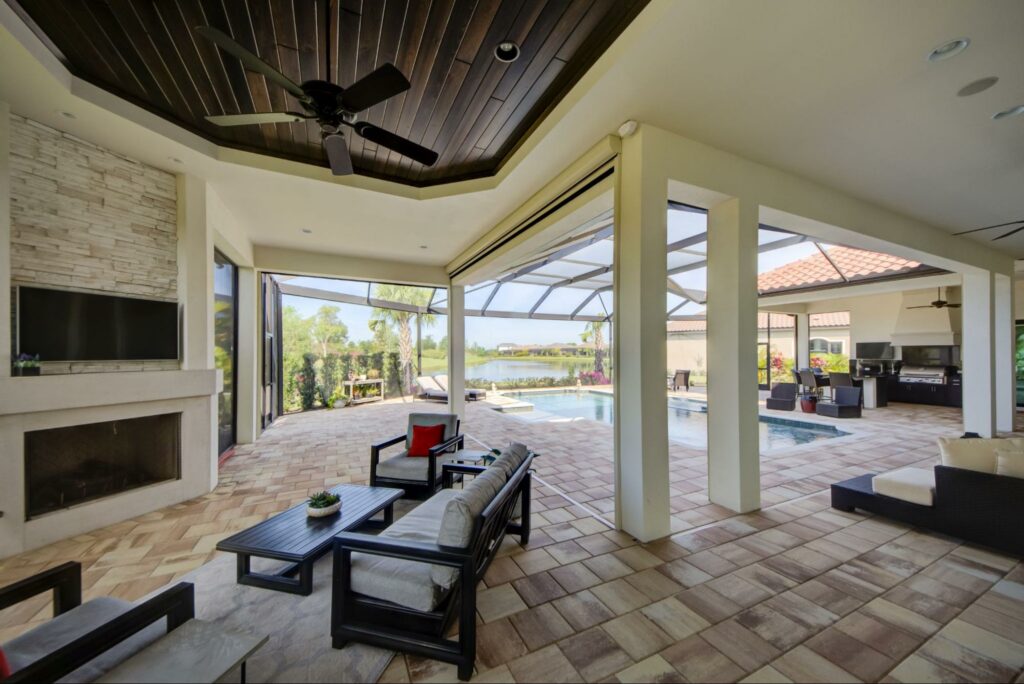 A retractable roll screen Sarasota by the pool from Sun Protection of Florida