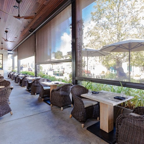 a restaurant featuring retractable sun screens from Sun Protection