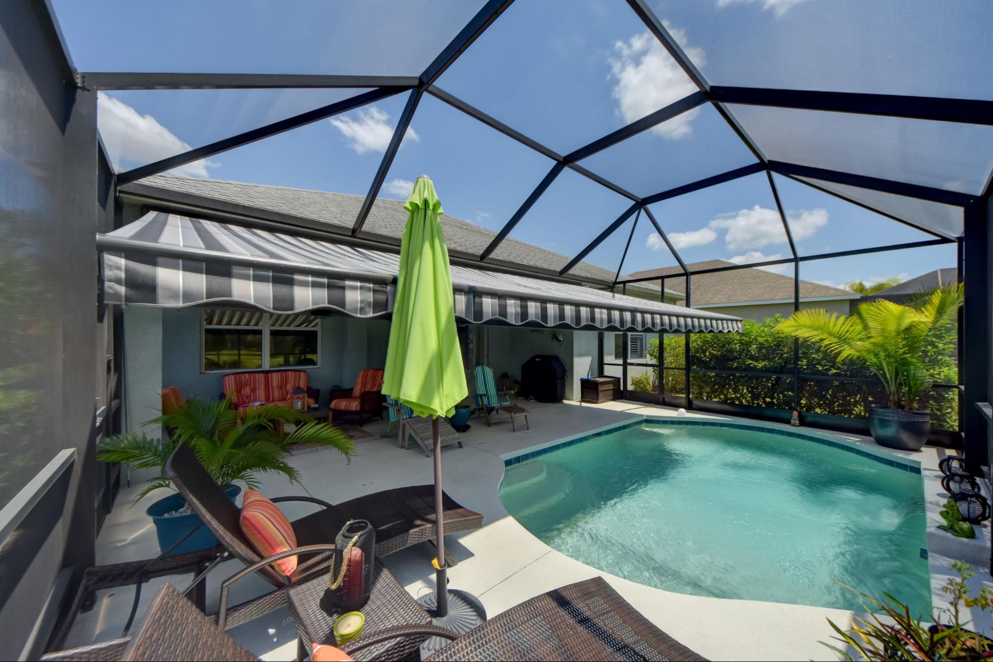 Awning covering poolside area from Sun Protection