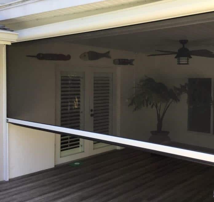 A North Naples patio has a retractable patio solar screen that allows them to enjoy their scenic views without the hot sun, rain, or annoying insects getting in the way.