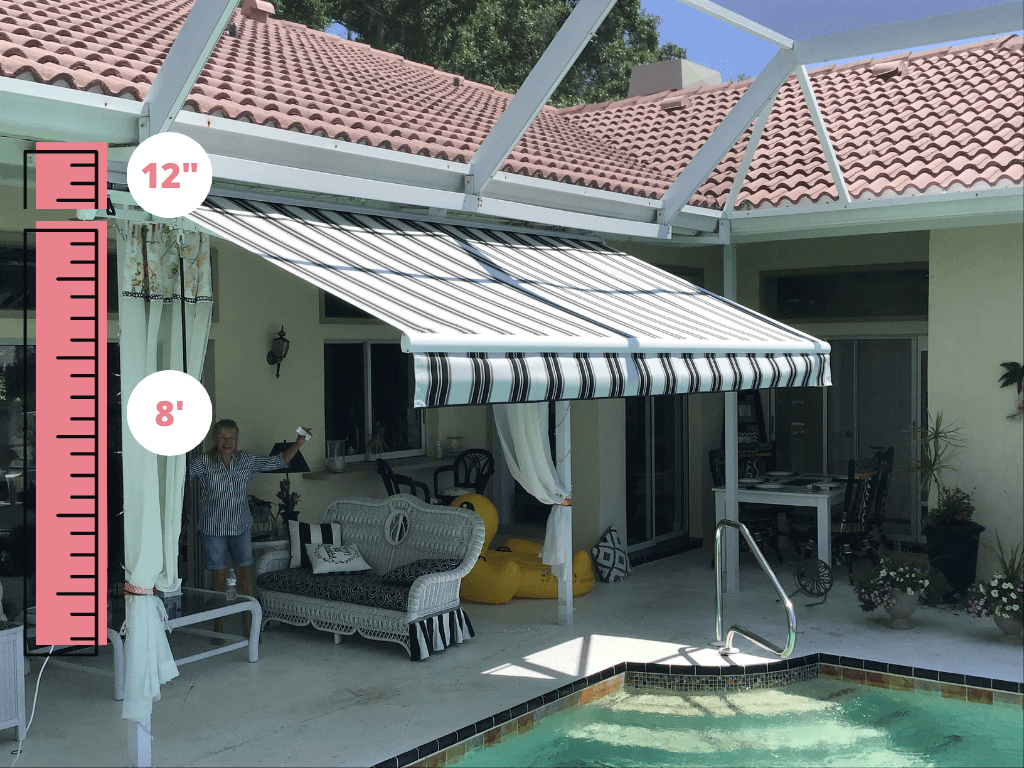 A retractable awning is unfurled with enough clearance after installation.