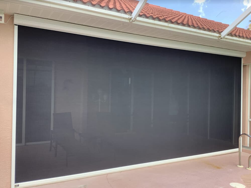 A motorized retractable patio screen in Florida