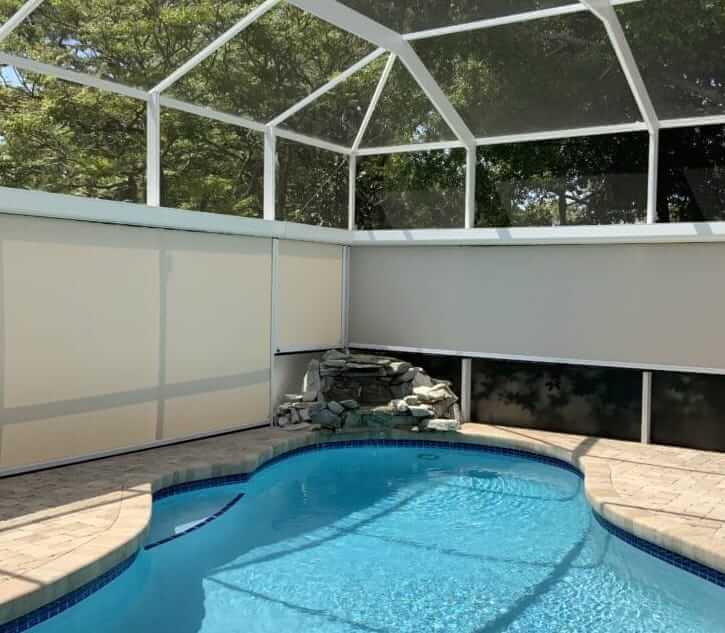 A beautiful pool features customized retractable solar screens that release with the remote-controlled operation. Read about the different motorized retractable screen options.