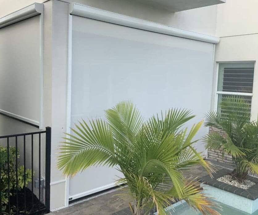 A poolside patio has complete privacy and protection against the hot Florida sun with a beautiful white motorized solar screen. Learn more about what SPF has to offer.