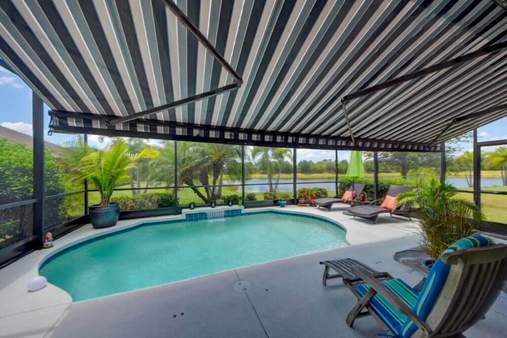 A motorized retractable awning installation project at a pool.