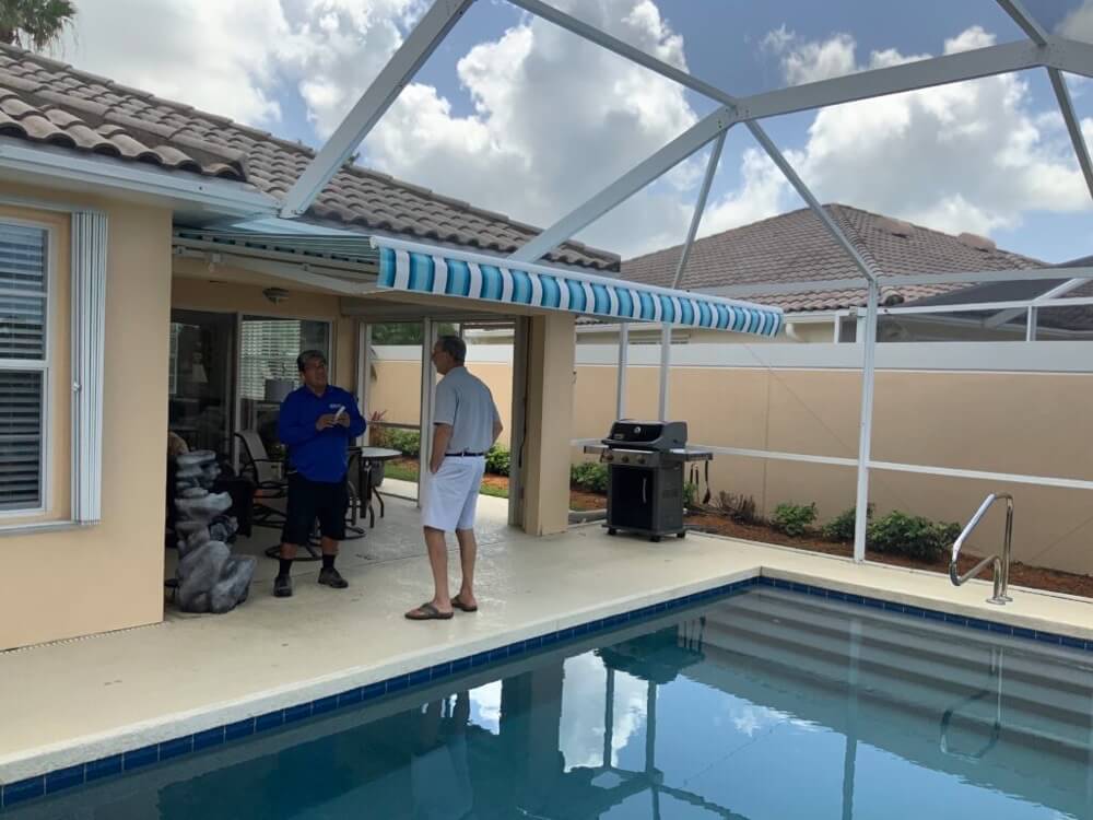 A serviceman from Sun Protection installing a motorized awning for one of our customers.